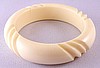 LG74 ivory slash carved lucite bangle